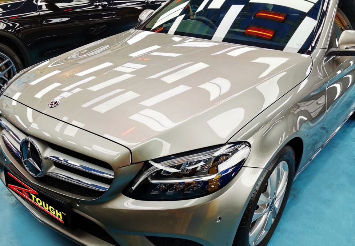 The Mercedes-Benz C180 from a side angle after the ceramic coating.