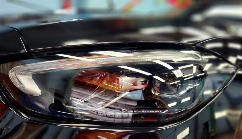 The C180's coated paintwork holding clean reflections.