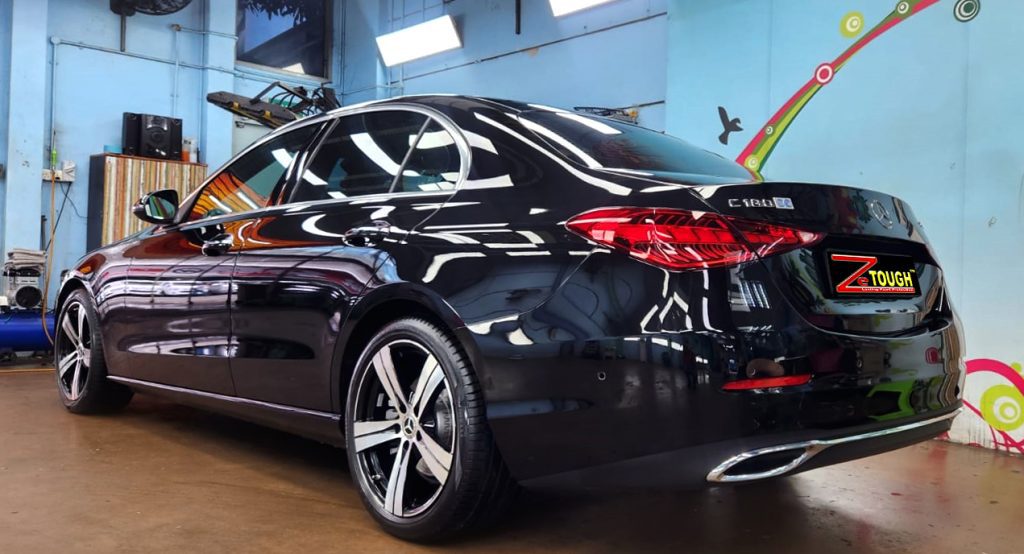 Rear quarter of the Mercedes-Benz C180, glossy and protected.