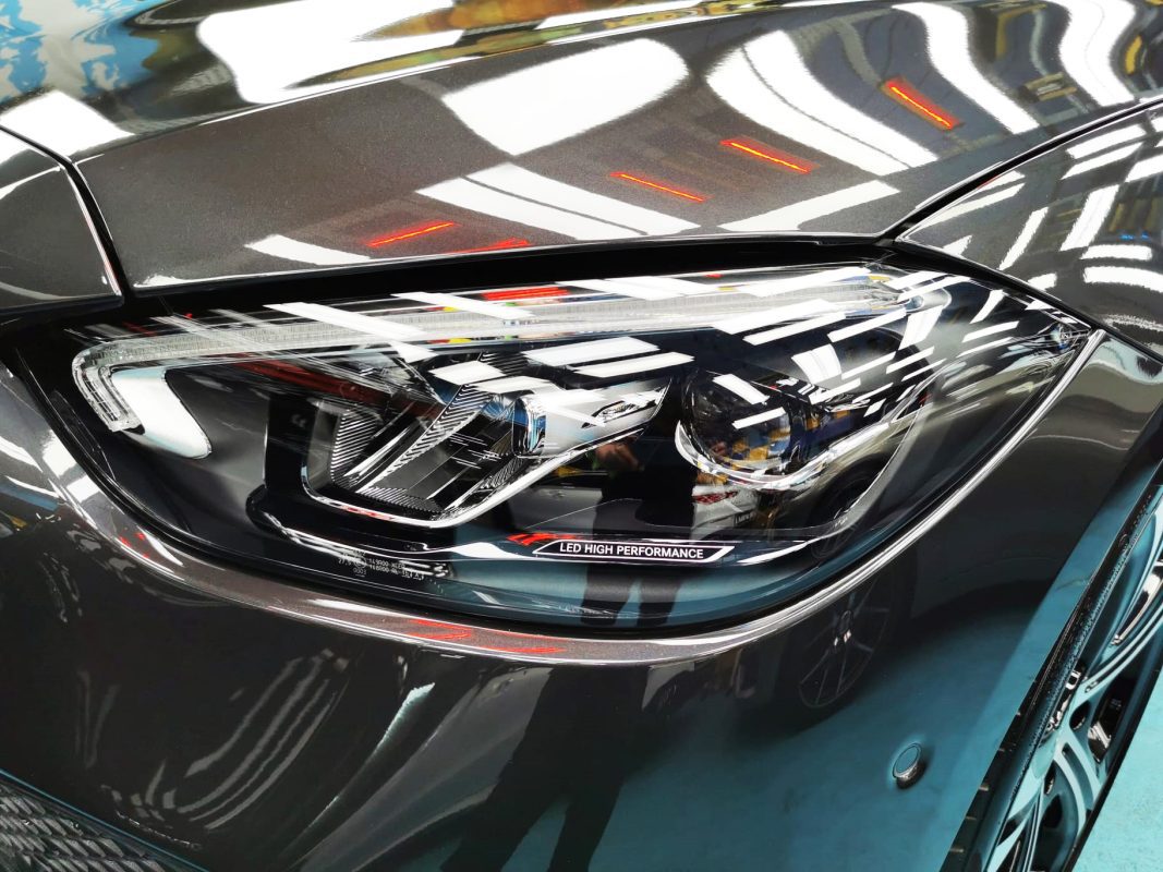The C200's coated paintwork showing clean reflections.