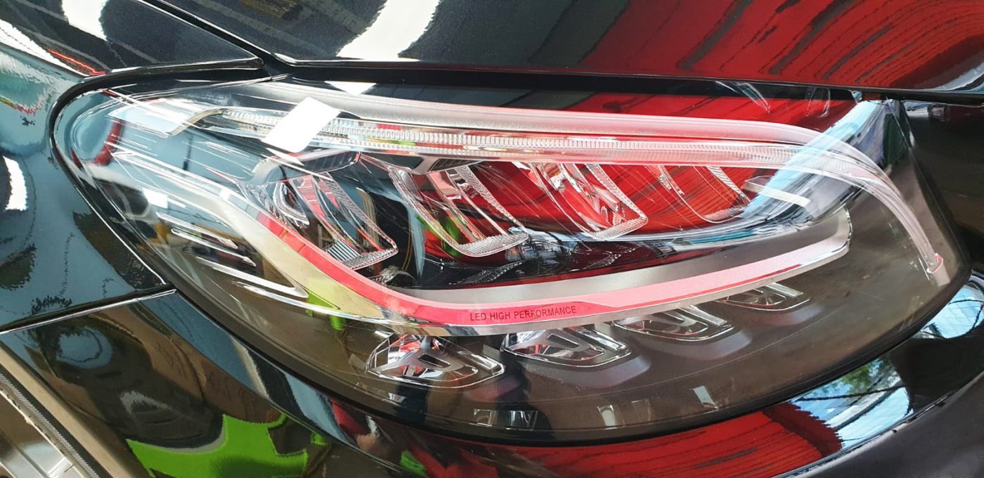 The C200 AMG's coated paintwork showing clean reflections.