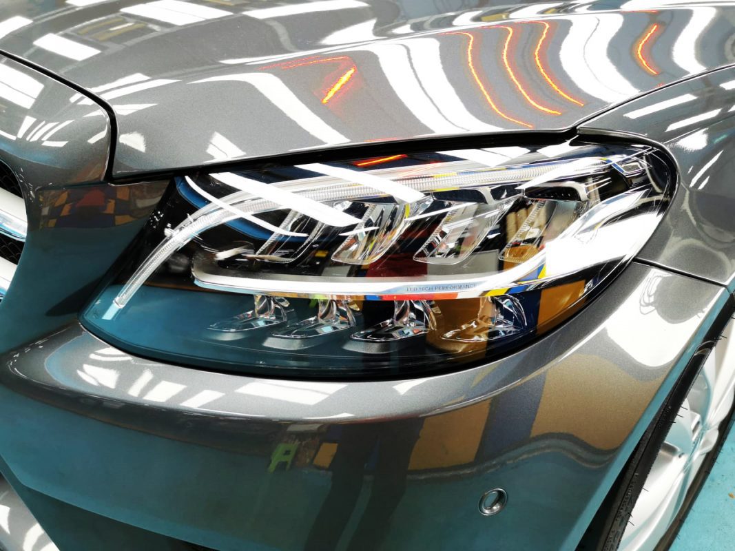 The C200's coated paintwork showing clean reflections.