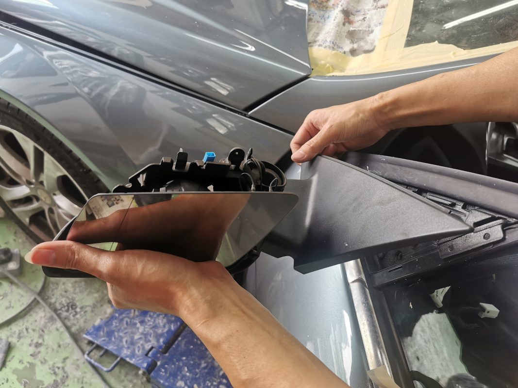 Buffing the new paint on the C200 to bring up the shine.