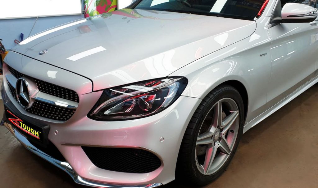 The Mercedes-Benz C200 from a side angle after the titanium coating.