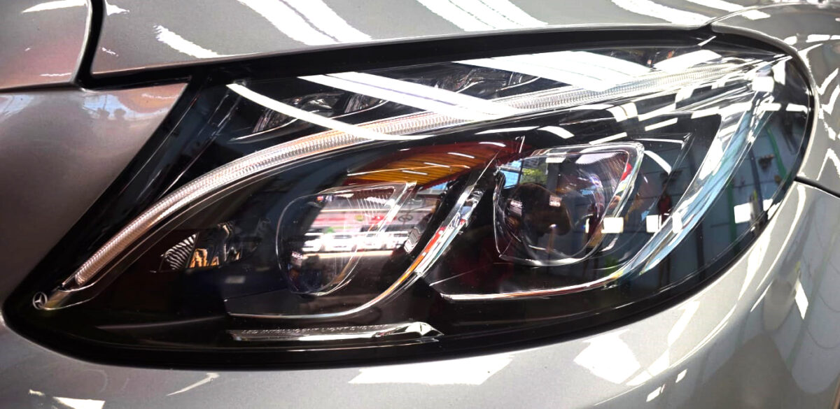 The C200's coated paintwork showing clean reflections.