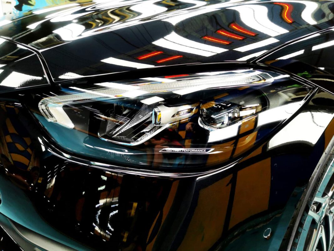 The C200's coated paintwork showing clean reflections.