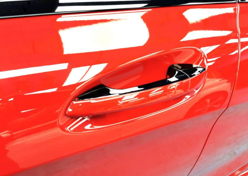 Front three-quarter view of the red Mercedes-Benz CLA 180 after coating.