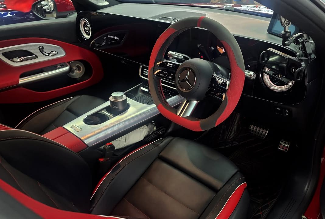 CLA interior with black and red seats and a red-trimmed steering wheel.
