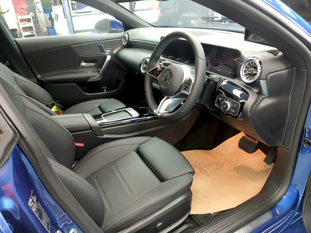 The Mercedes-Benz CLA180 parked in the workshop, freshly coated.