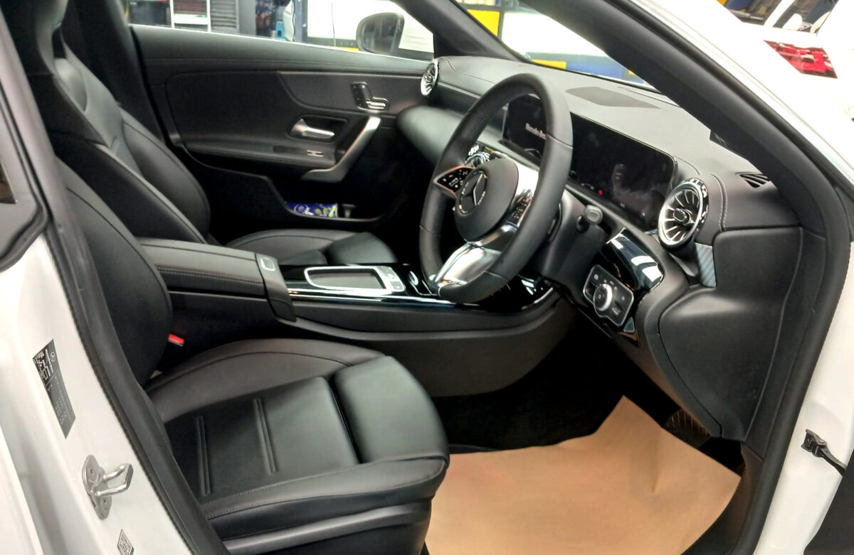 The Mercedes-Benz CLA180 parked in the workshop, freshly coated.