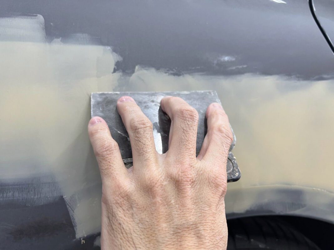 The CLA180's panels being checked and patched as bodywork repairs begin.