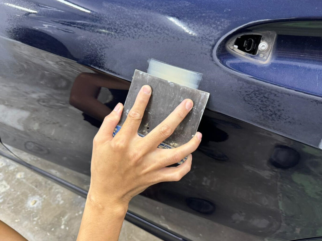 Surface repair work on a panel of the Mercedes-Benz CLA200.