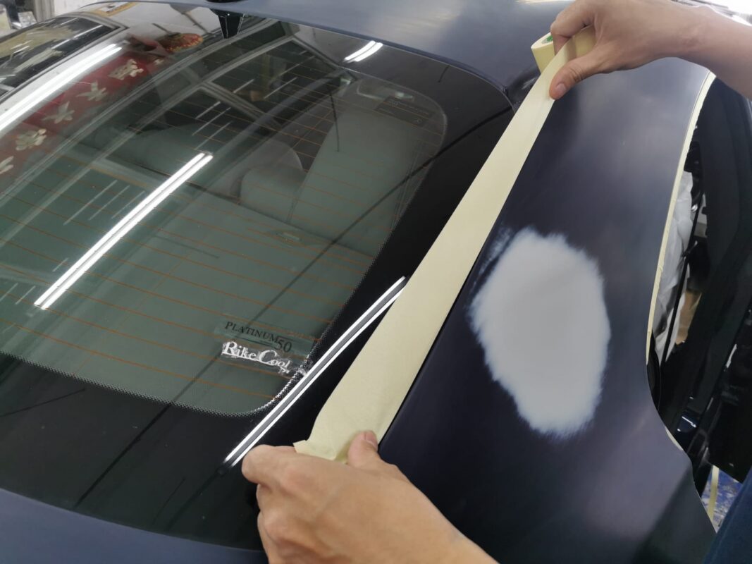 The CLA200 in the spray booth with fresh paint being applied.