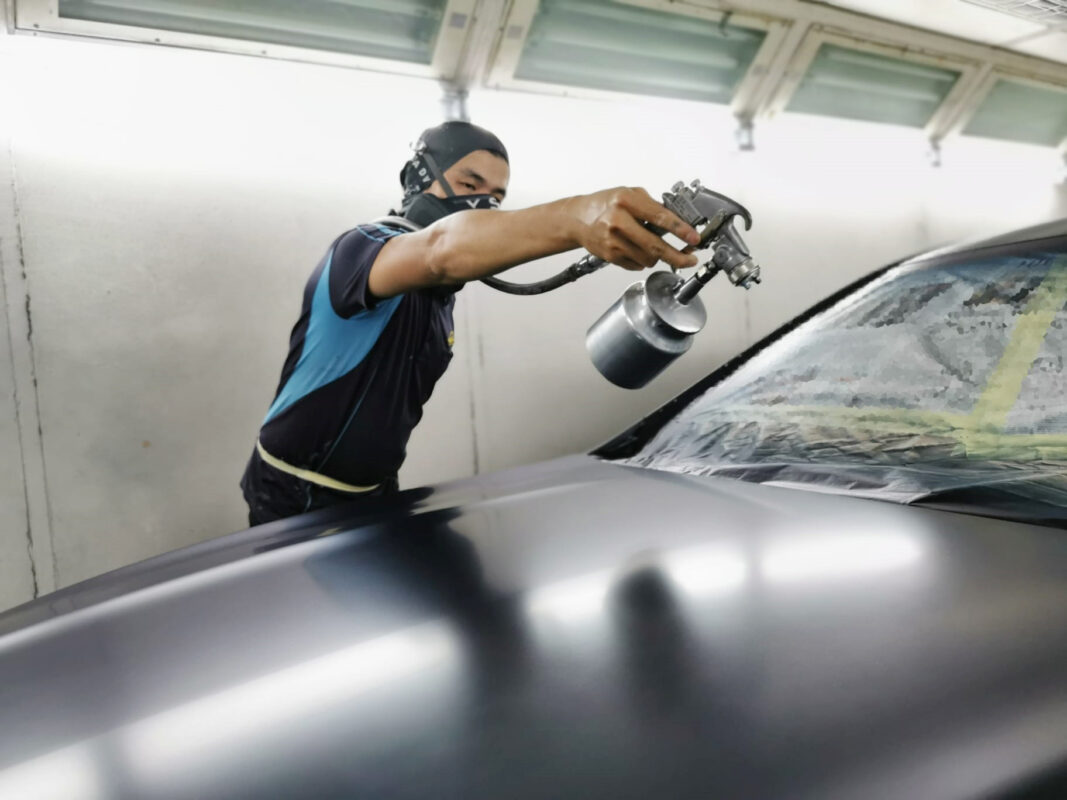 Machine-polishing the CLA200 after the respray to bring up the gloss.