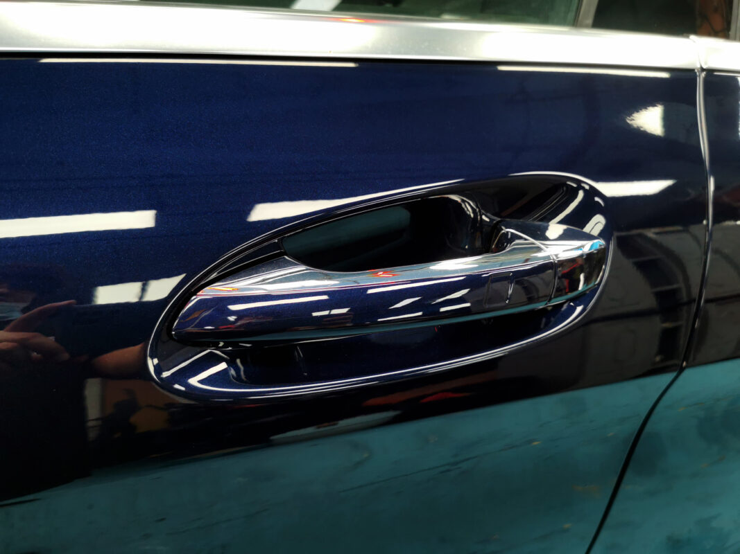 After: the same car with a fresh full respray, polished to a high gloss.