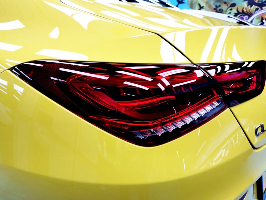 The coated bonnet of the CLA250 under workshop lighting.