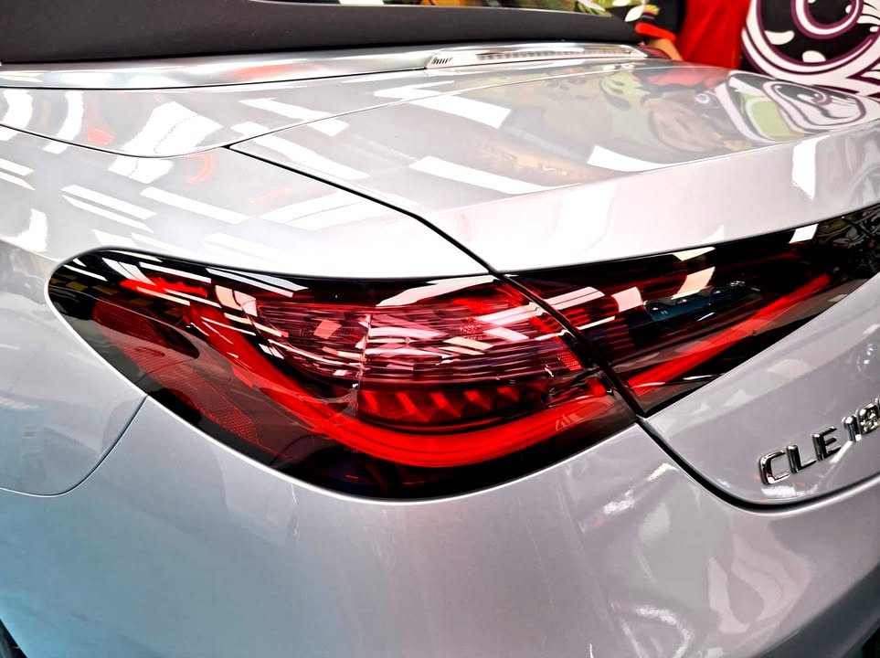 Close-up of the red tail light and CLE badge on the silver boot lid.