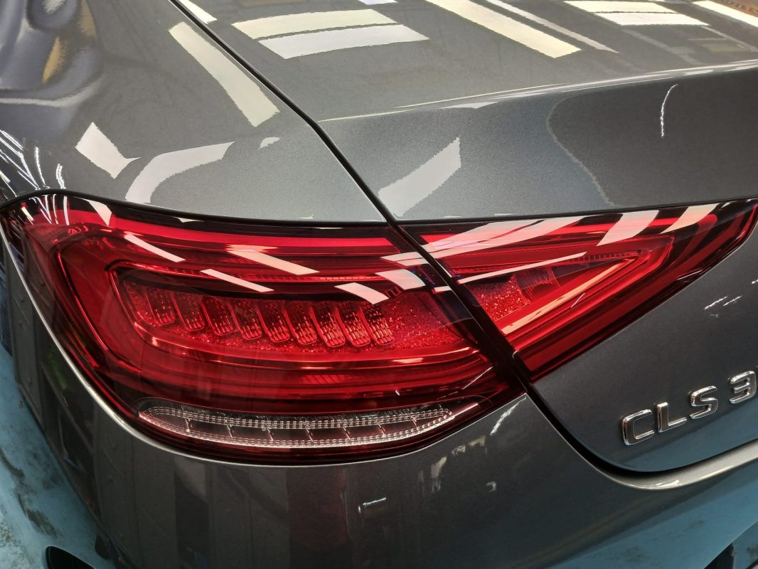 Rear quarter of the Mercedes-Benz CLS350, glossy and protected.