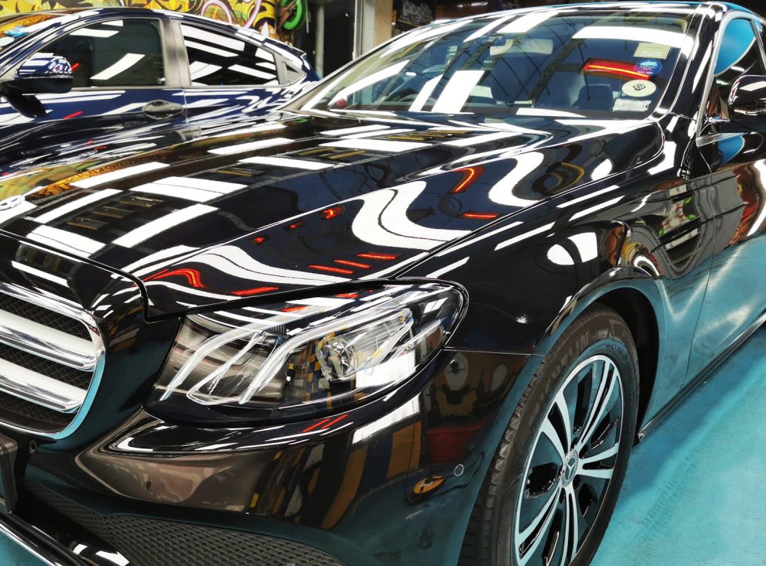 The Mercedes-Benz E180 from a side angle after the ceramic coating.