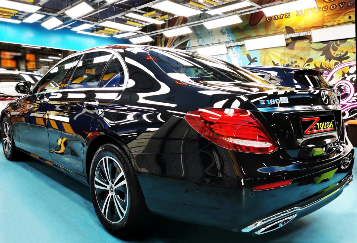 Rear quarter of the Mercedes-Benz E180, glossy and protected.