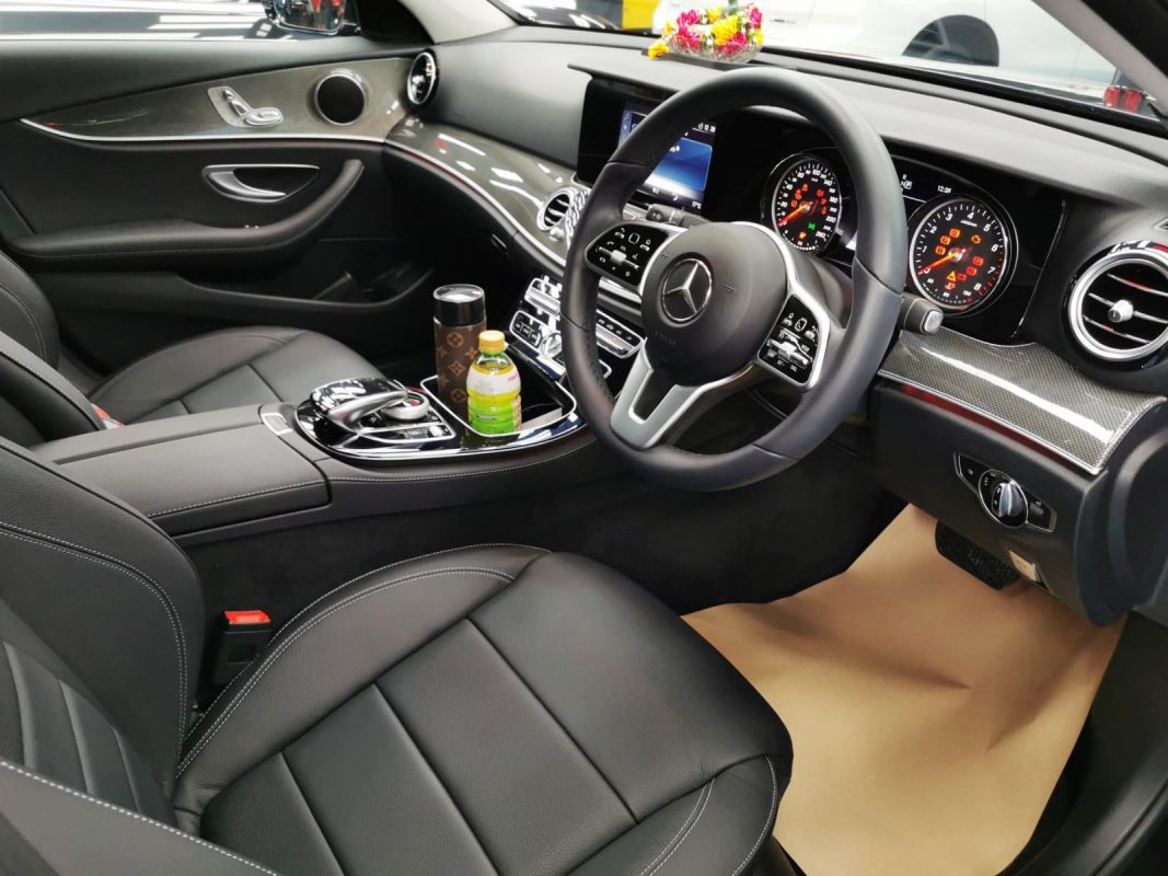 The Mercedes-Benz E180 parked in the workshop, freshly coated.
