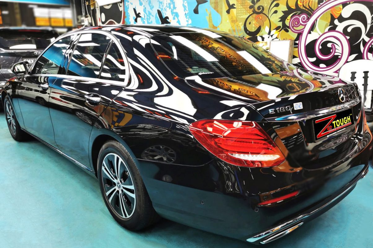 Rear quarter of the Mercedes-Benz E180, glossy and protected.