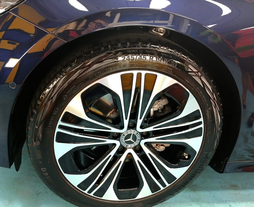 Rear quarter of the Mercedes-Benz E200, glossy and protected.