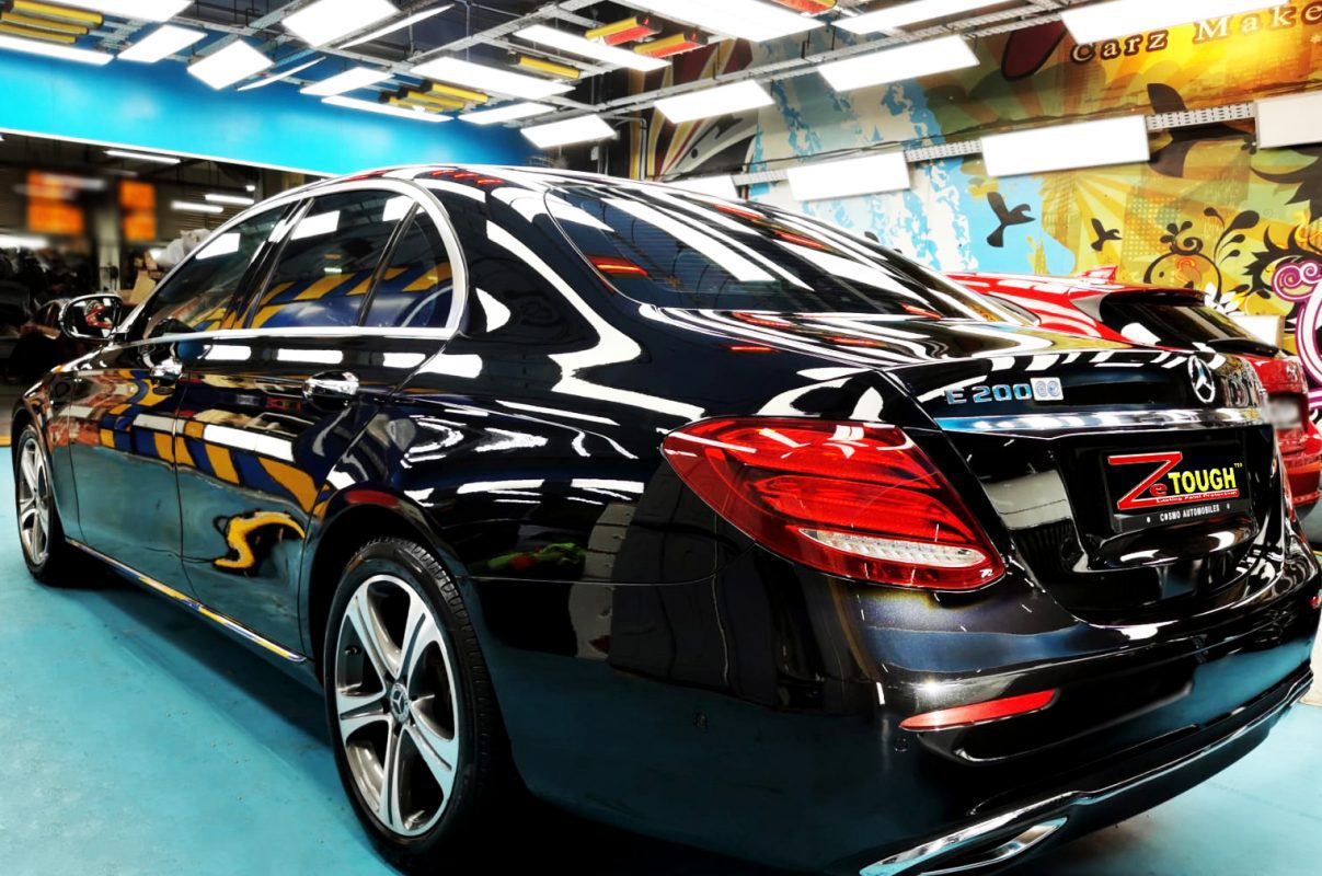 Rear quarter of the E200, glossy and protected.