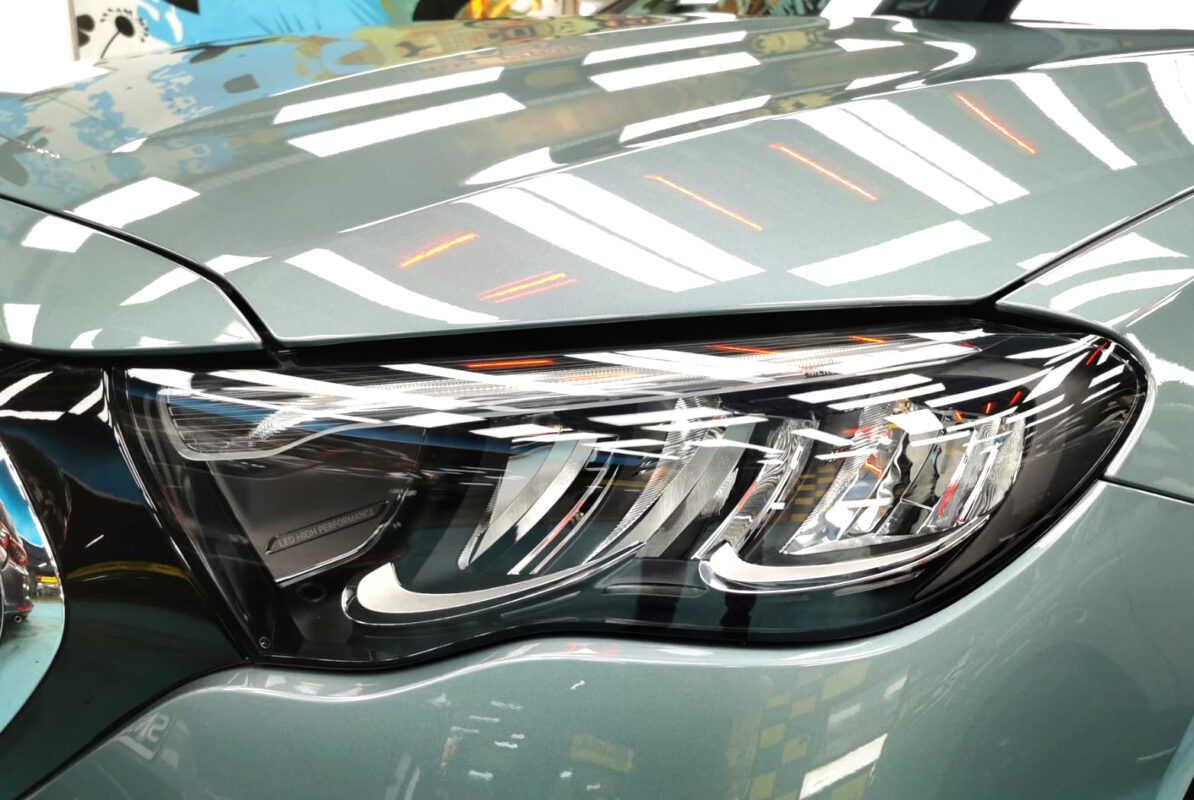 The E200's coated paintwork showing clean reflections.