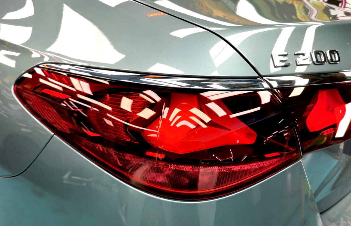 Rear quarter of the Mercedes-Benz E200, glossy and protected.
