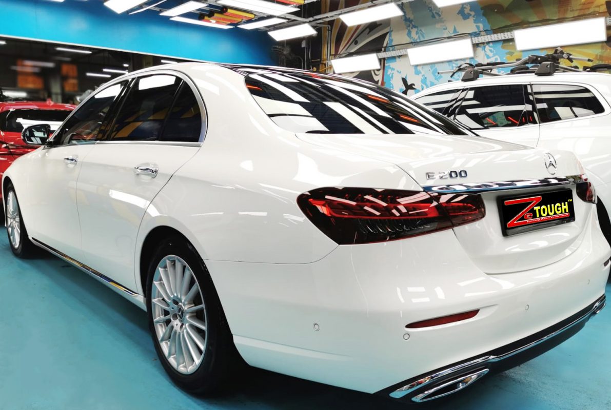 Rear quarter of the Mercedes-Benz E200, glossy and protected.