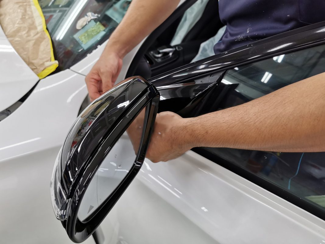 Buffing the new paint on the E200 to bring up the shine.