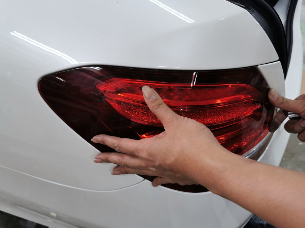Previously removed car parts being refitted onto the E200.