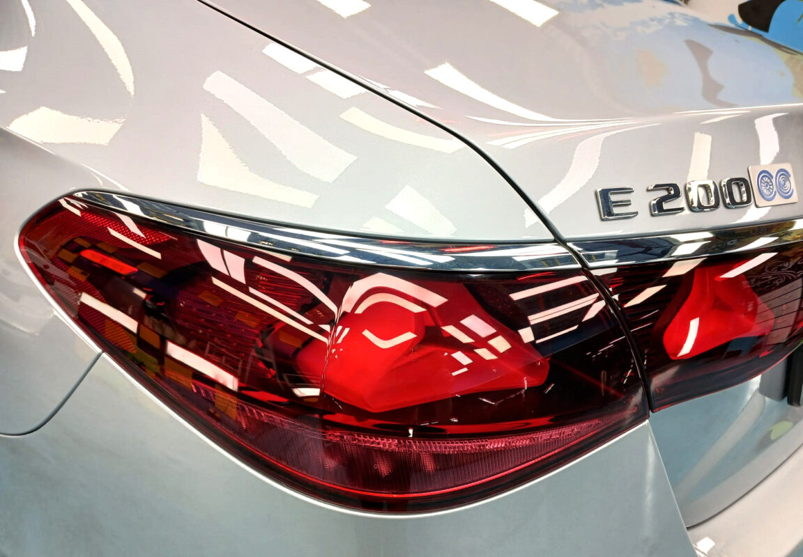 Rear quarter of the Mercedes-Benz E200, glossy and protected.