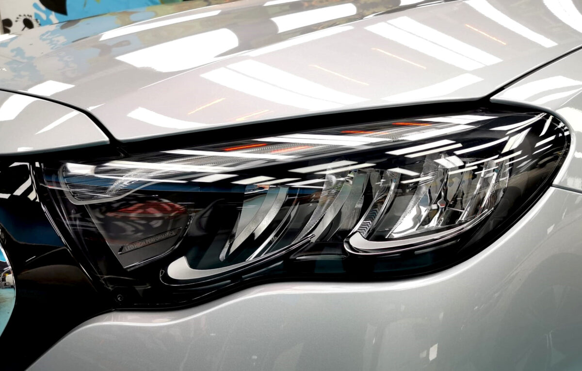 The E200's coated paintwork showing clean reflections.