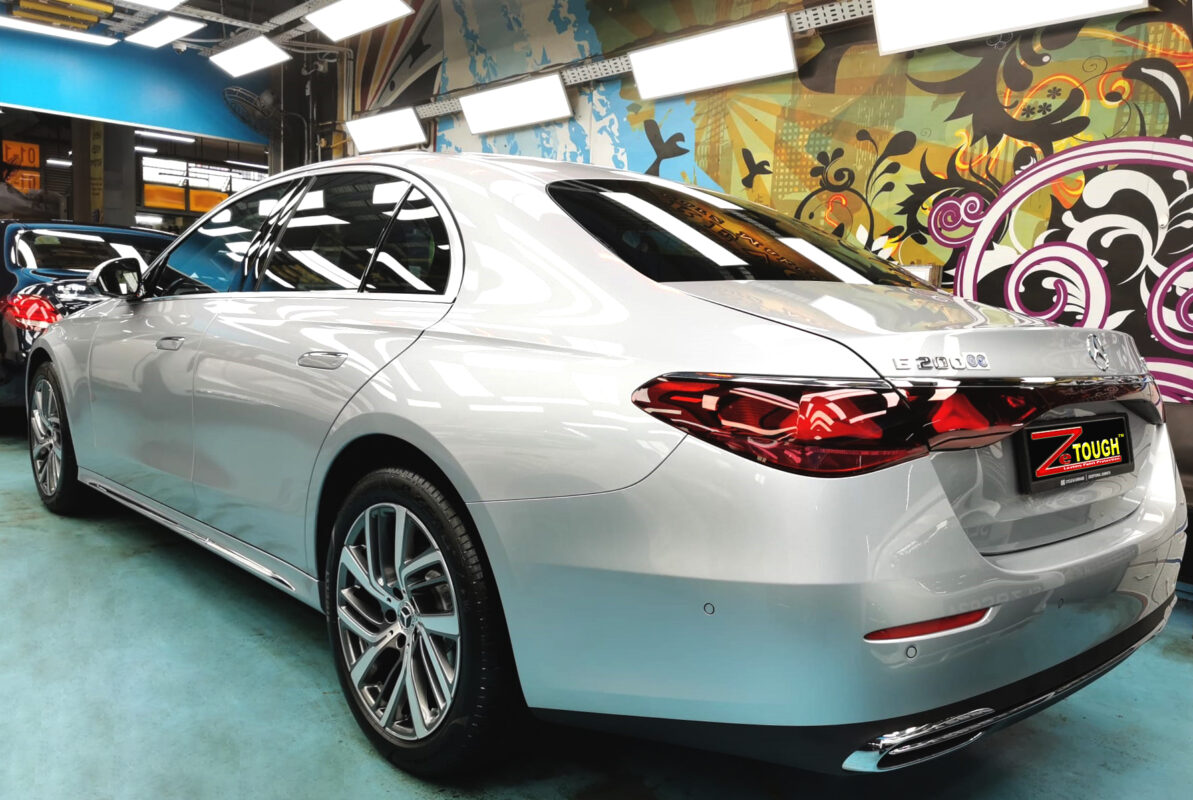 Rear quarter of the Mercedes-Benz E200, glossy and protected.