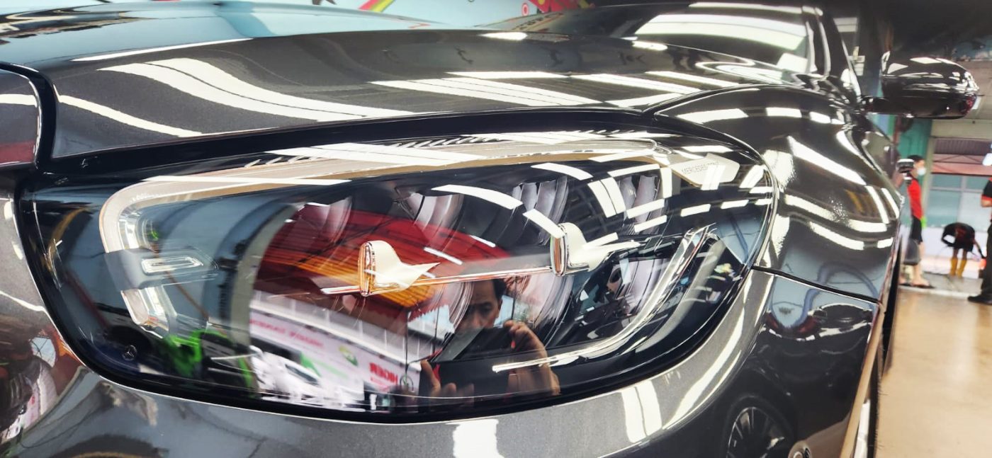 The E200's coated paintwork showing deep reflections.