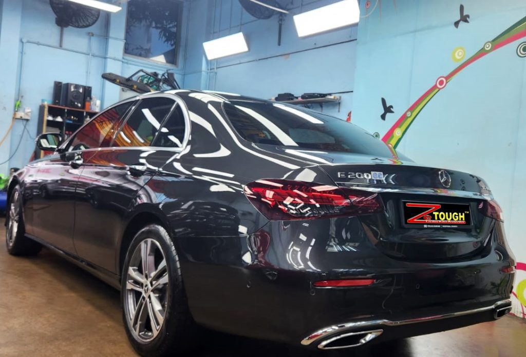 Rear quarter of the Mercedes-Benz E200, glossy and protected.