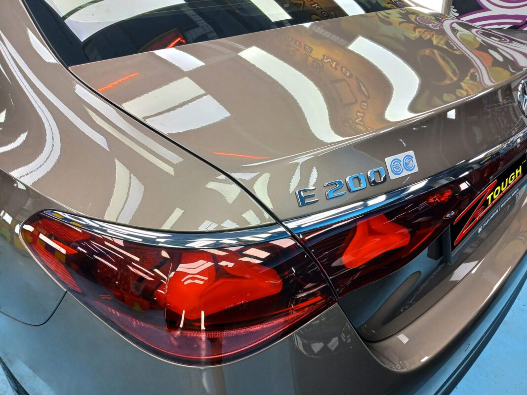 Rear quarter of the Mercedes-Benz E200, glossy and protected.
