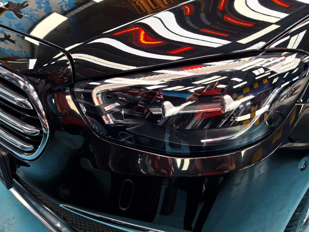 The E200's coated paintwork showing clean reflections.