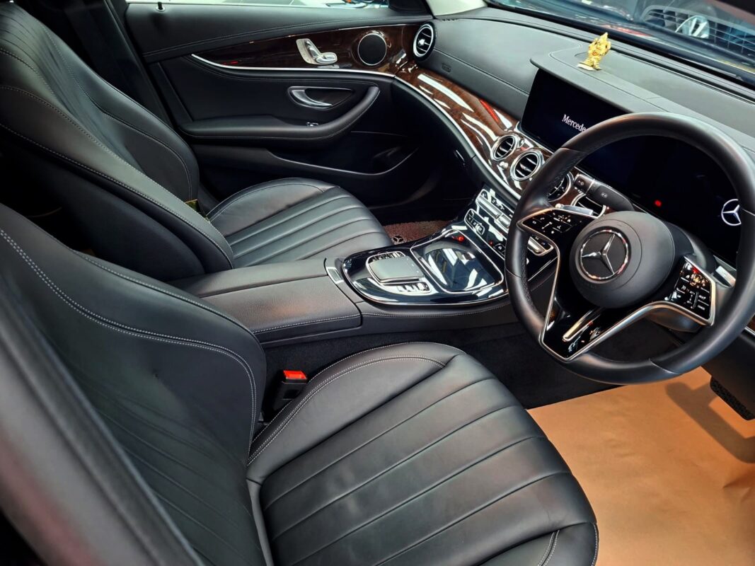 The Mercedes-Benz E200 parked in the workshop, freshly coated.