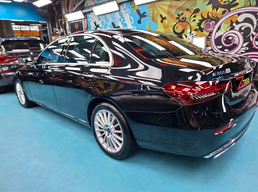 Rear quarter of the Mercedes-Benz E200, glossy and protected.