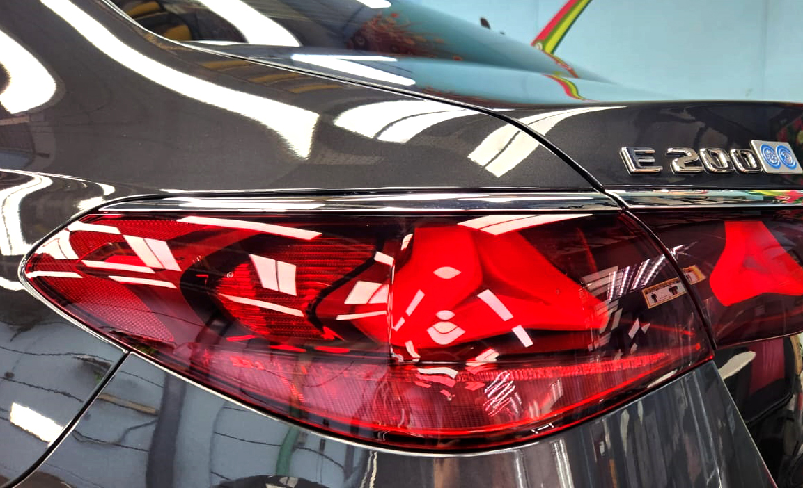 Rear quarter of the Mercedes-Benz E200, glossy and protected.