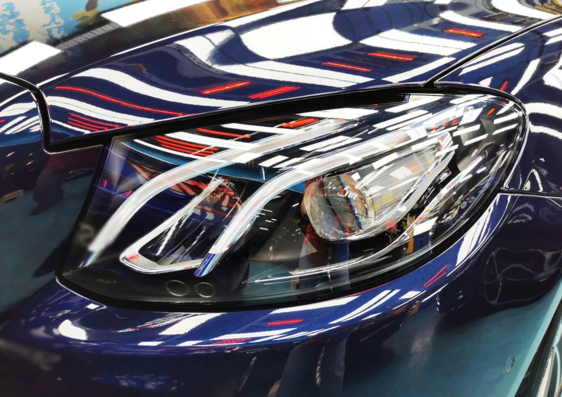 The E200K's coated paintwork holding clean reflections.