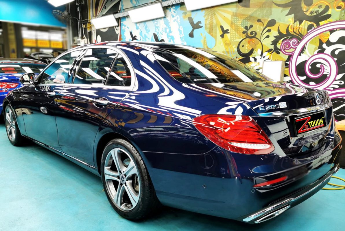 The bonnet of the E200K under workshop lighting.