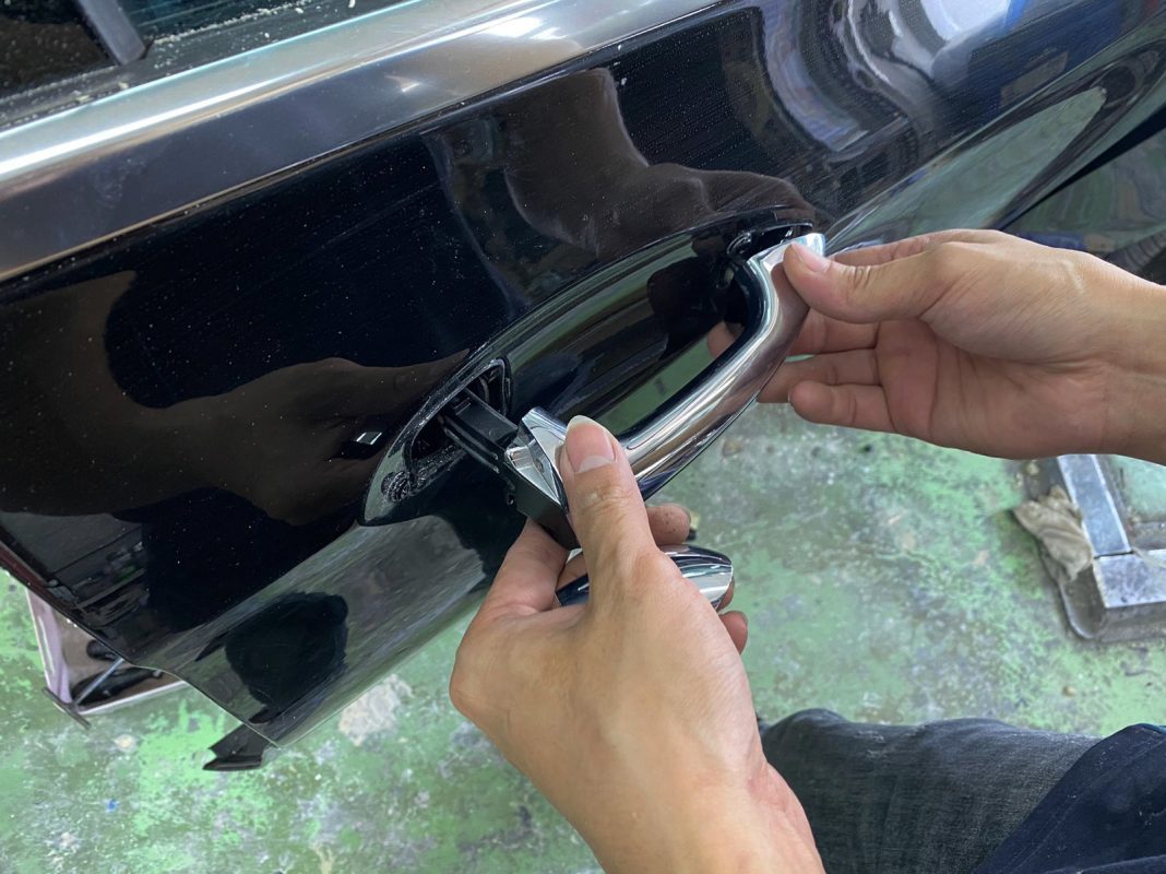 Buffing the new paint on the E220d to bring up the shine.