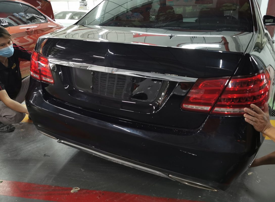 Previously removed car parts being refitted onto the E250.