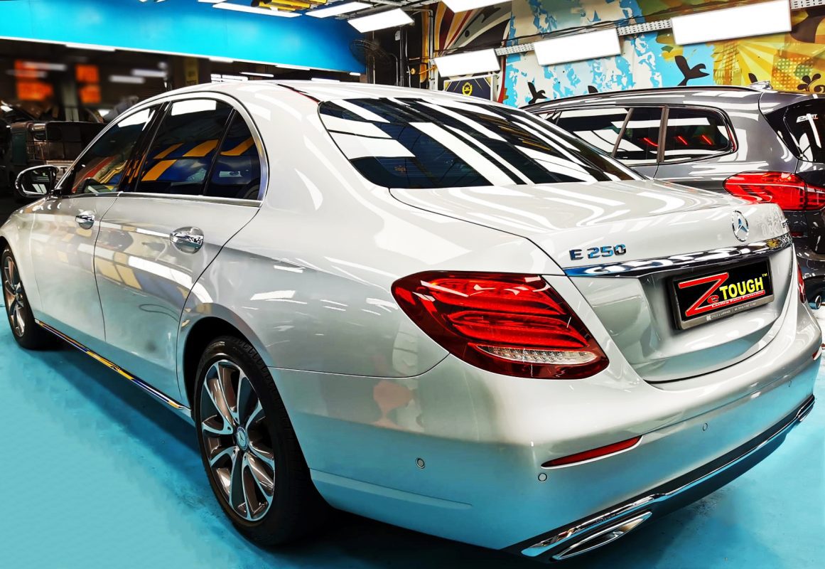 Rear quarter of the Mercedes-Benz E250, glossy and protected.