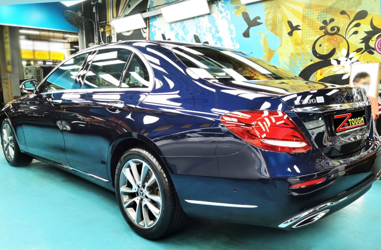 Rear quarter of the E300, glossy and protected.