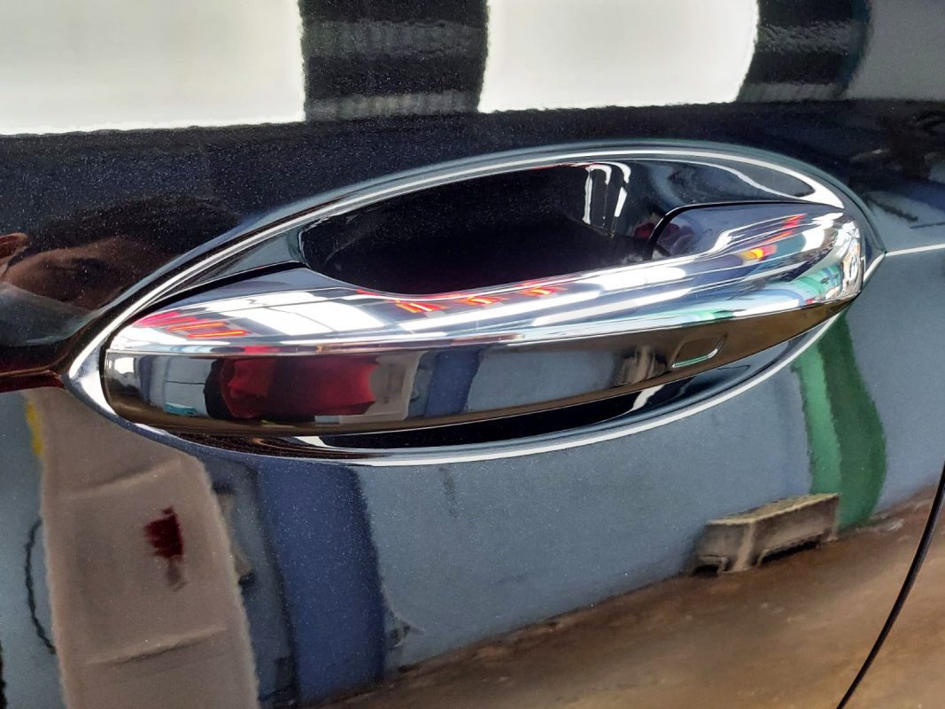 Rear quarter of the Mercedes-Benz E300, glossy and protected.